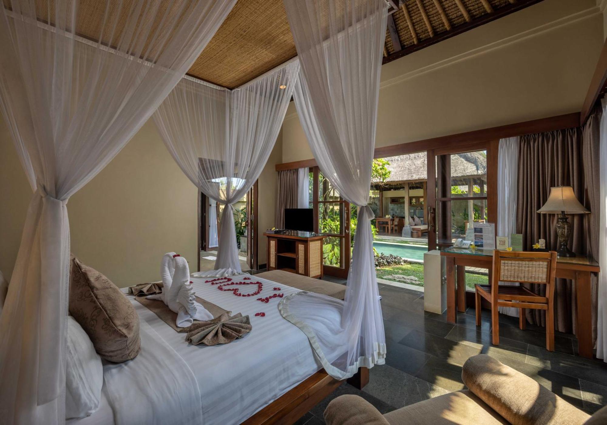 우붓 뉴 발리 리조트&스파 객실 사진 A bedroom at the resort