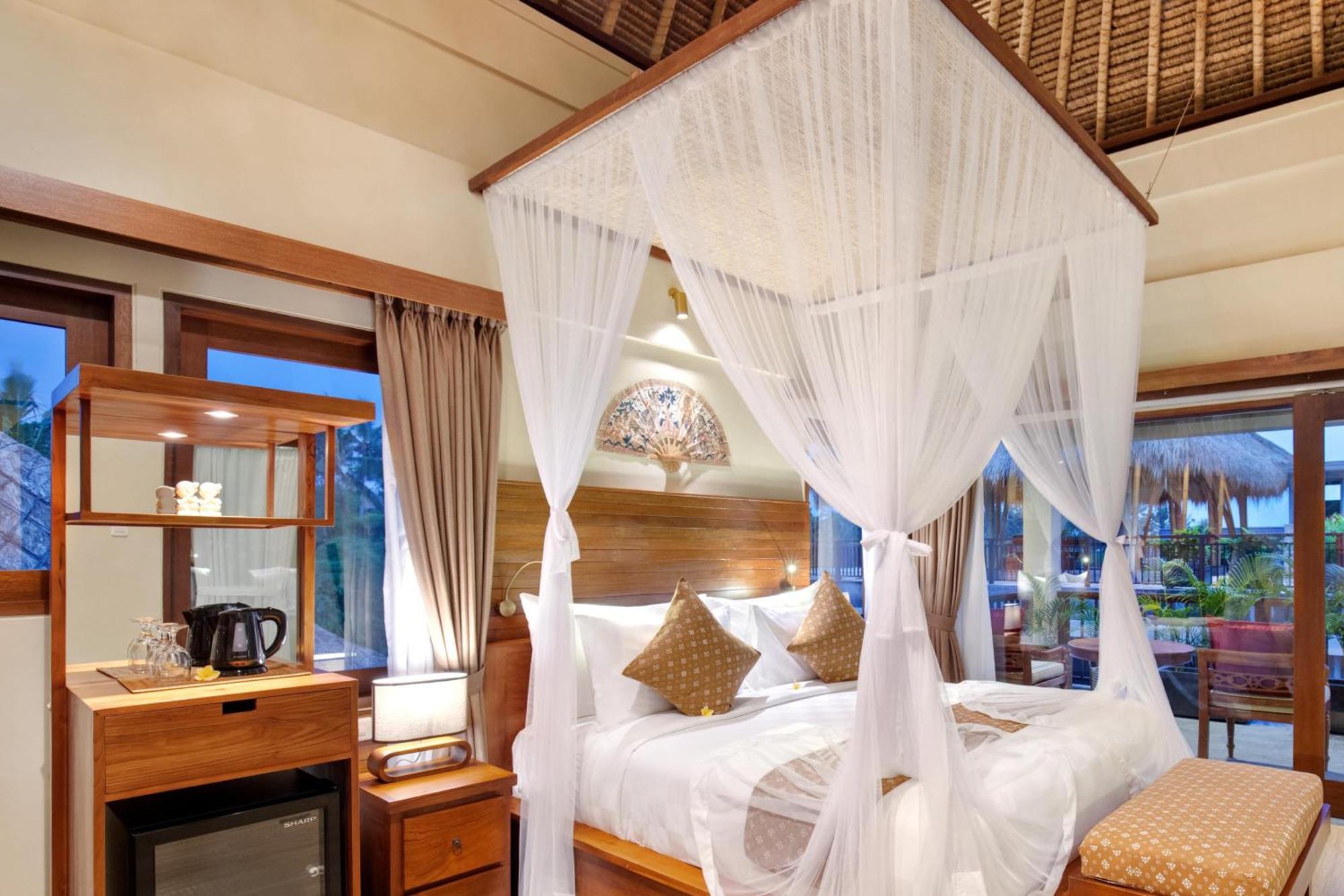 우붓 뉴 발리 리조트&스파 객실 사진 A mosquito net over a bed