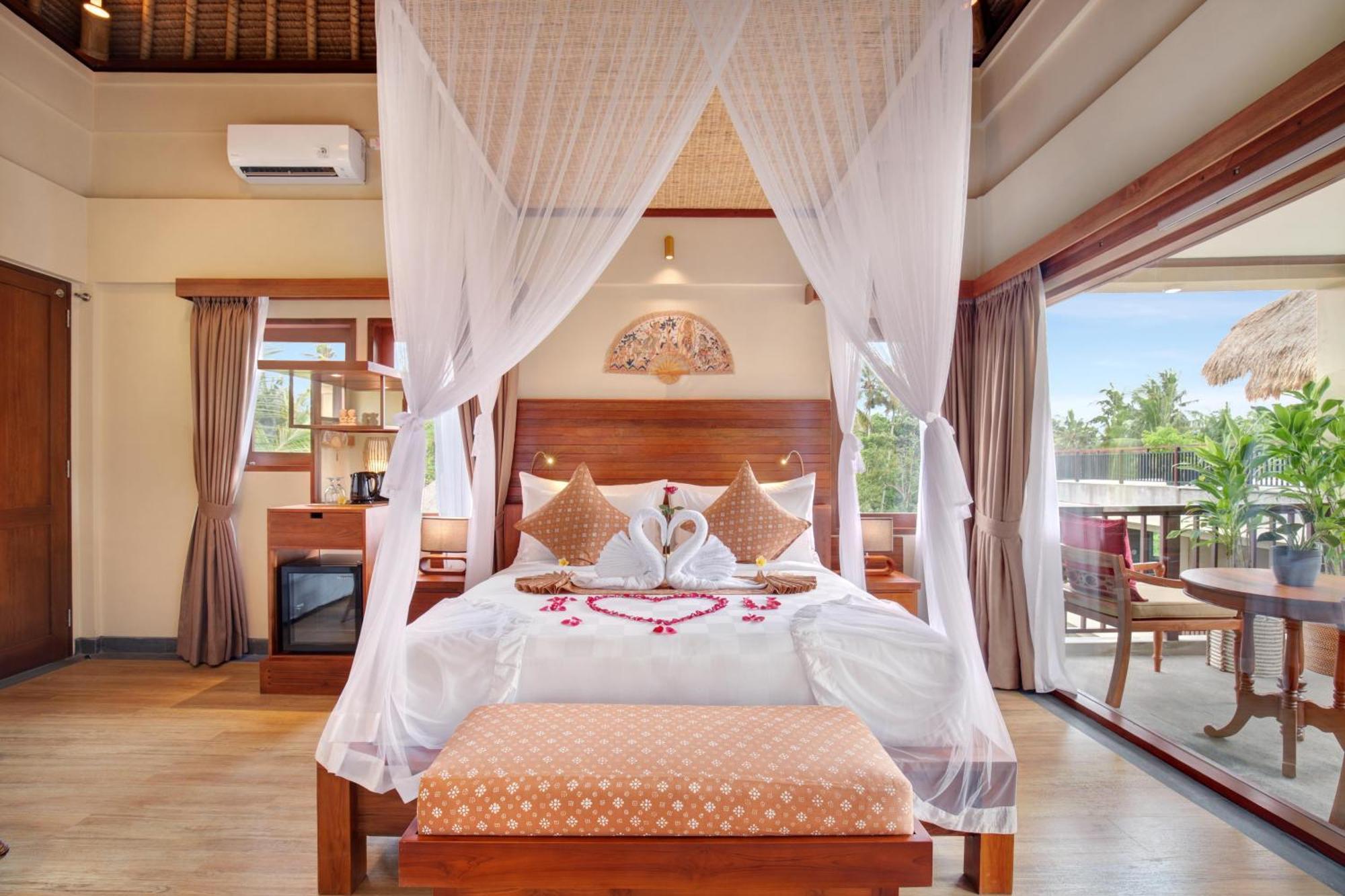 우붓 뉴 발리 리조트&스파 객실 사진 A bedroom at the resort